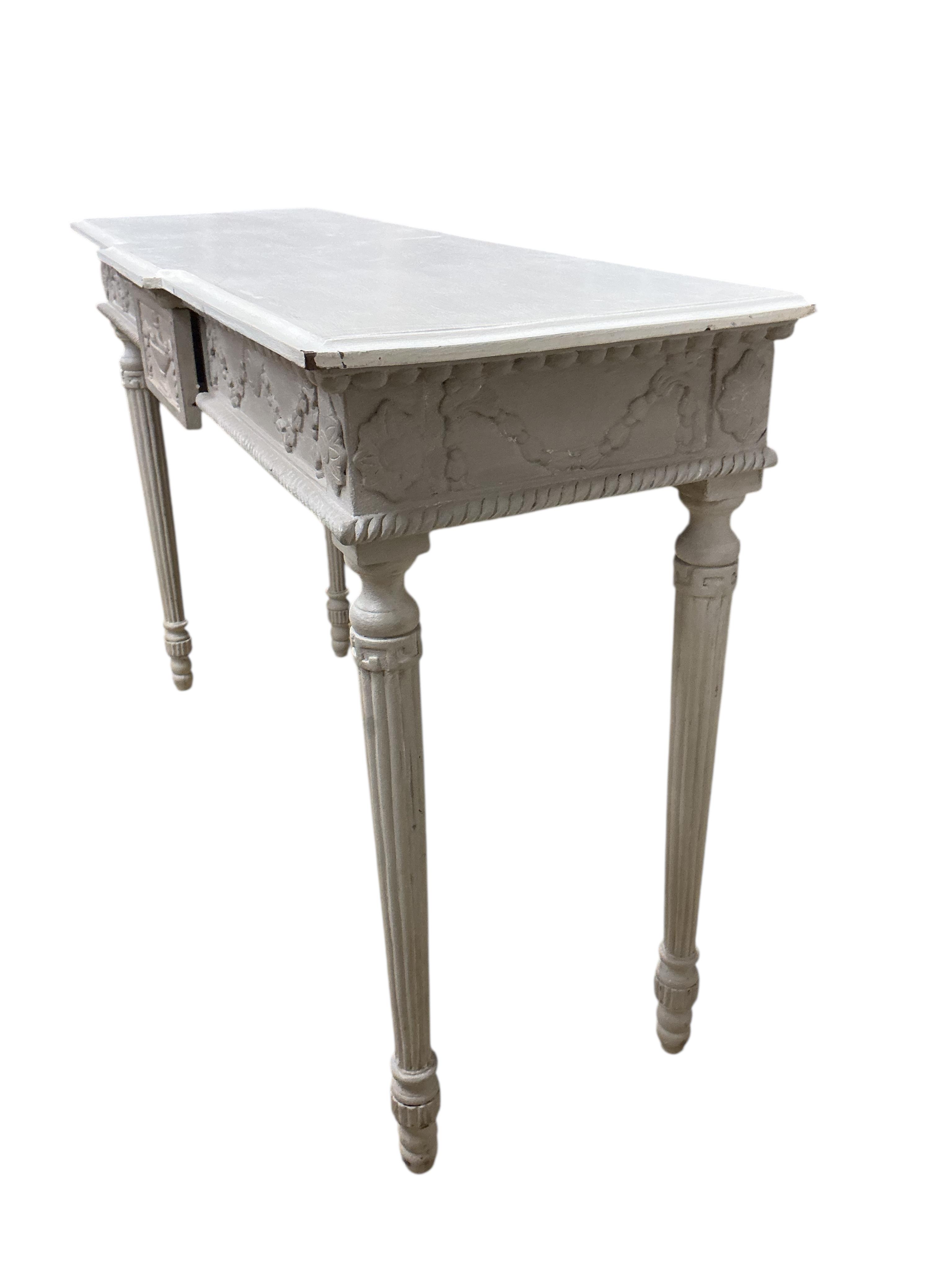 An Adam style painted breakfront console table, width 124cm, depth 41cm, height 81cm